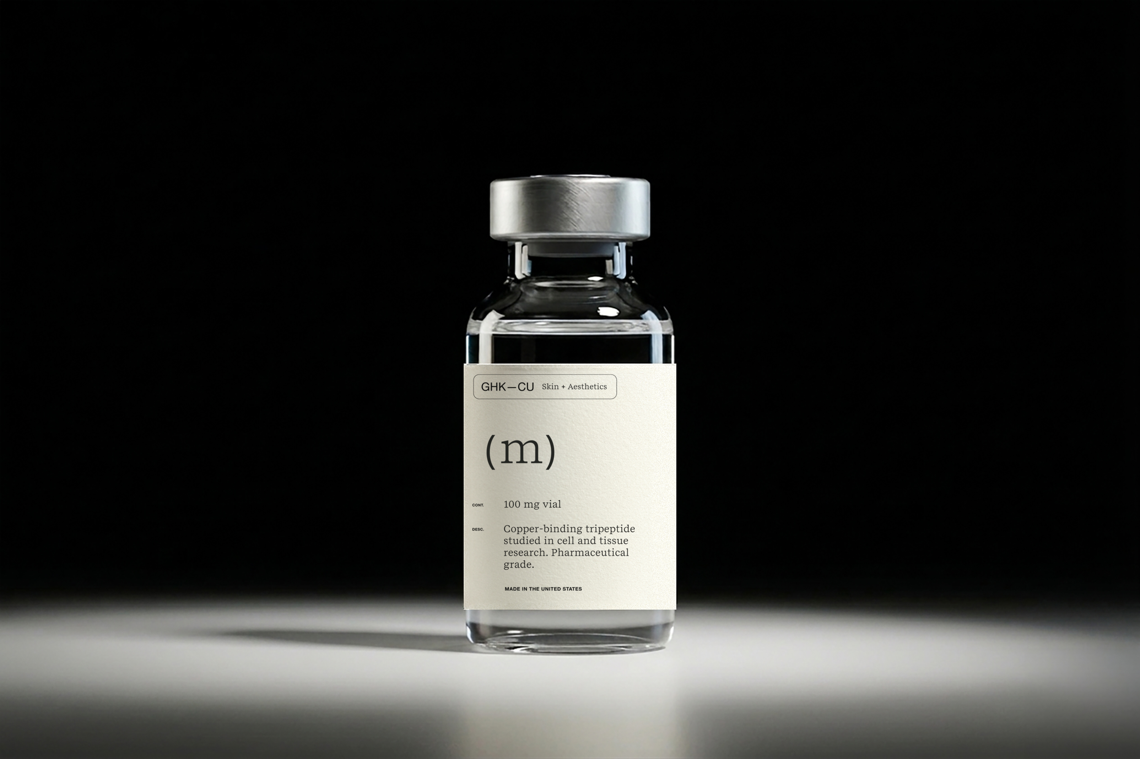 Mino GHK-Cu pharmaceutical-grade vial under dramatic studio light